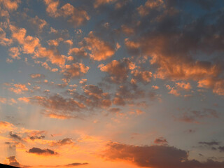 Magnificent city sunset with fiery clouds