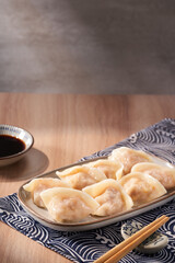 Delicious and tempting dumpling scene against a wood grain background