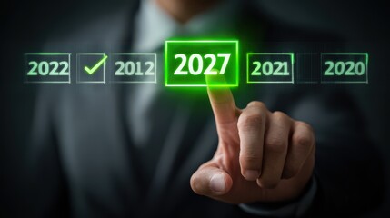 Hand Of Businessman Selecting Highlighted 2027 Year On Virtual Interface With Green Check Mark Representing Future Planning
