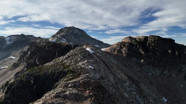 Majestic Aerial View of Rugged Mountains with Snow Patches in British Columbia, Canada