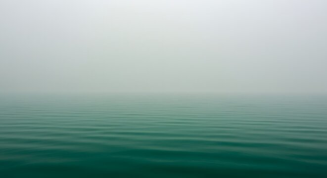 Ha Long Bay, Vietnam Misty Teal Ocean Water Surface Texture with Foggy Horizon Calm A