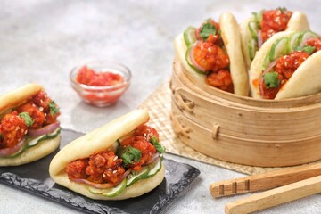 Korean Pao.Bao buns with chicken crispy and vegetable. Asian cuisine