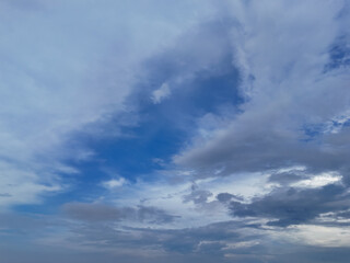 Blue sky with billowing white clouds and atmospheric cloudscape