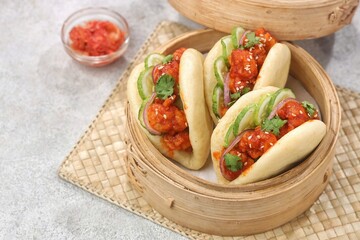 Korean Pao.Bao buns with chicken crispy and vegetable. Asian cuisine