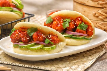 Korean Pao.Bao buns with chicken crispy and vegetable. Asian cuisine