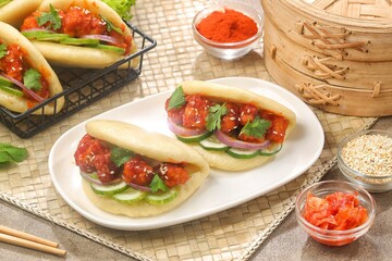 Korean Pao.Bao buns with chicken crispy and vegetable. Asian cuisine