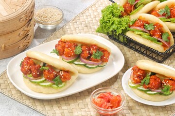 Korean Pao.Bao buns with chicken crispy and vegetable. Asian cuisine