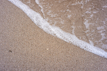 flat lay of sea foam on the beach