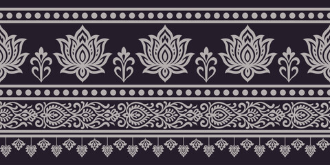 Floral ornamental border with lotus motifs and intricate decorative patterns in gray on black background, elegant and symmetrical design