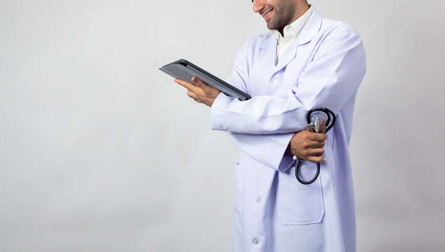 Close up hand with Digital Tablet computer tecnology. portrait happy Confident hispanic man doctor, healthcare wellness career. medical professional worker smile and confident surgeon, expert employee - Powered by Adobe