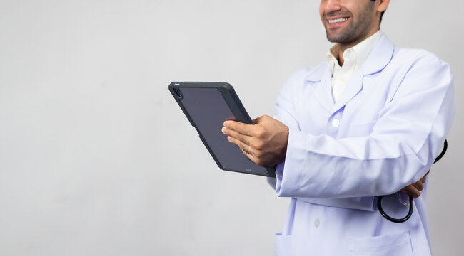 Close up hand with Digital Tablet computer tecnology. portrait happy Confident hispanic man doctor, healthcare wellness career. medical professional worker smile and confident surgeon, expert employee