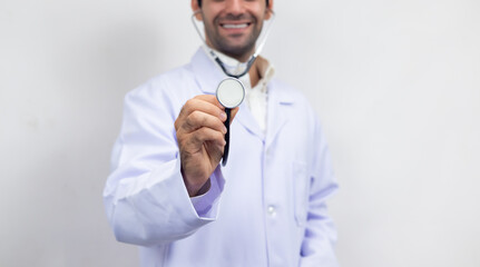 Close up stethoscope in hand doctor . portrait happy Confident hispanic man doctor, healthcare wellness career. medical professional worker smile and confident surgeon, expert employee