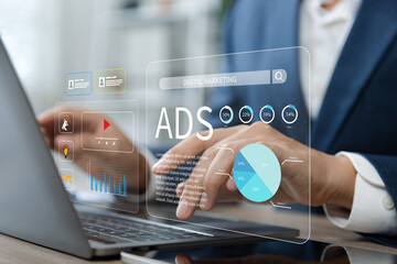 Businessman using laptop with Ads dashboard digital marketing strategy analysis for branding.
