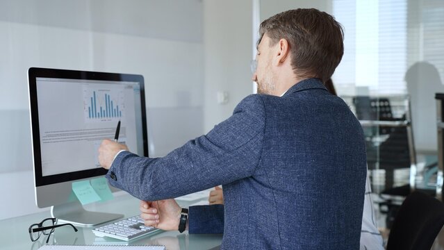 Business professionals analyzing financial data, discussing market trends, and collaborating on a project in the office. Businesspeople concept