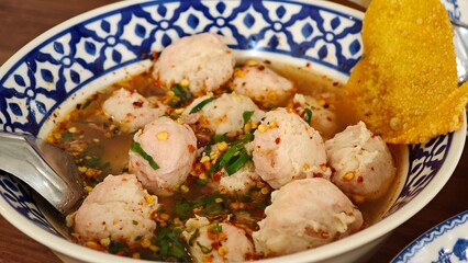 Pork patty or bouncy pork in Tom Yum soup.