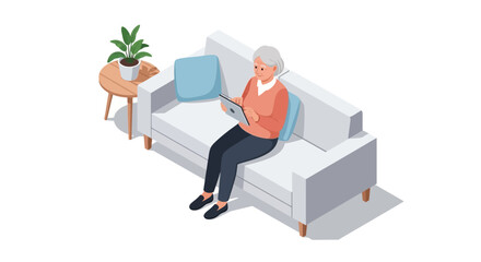 Elegant senior woman comfortably browsing tablet on sofa, enjoying modern home technology and digital connectivity at leisure.