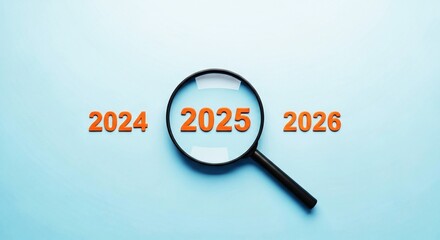 Magnifying glass focusing on the year 2025, symbolizing future planning, forecasting, and business strategy.