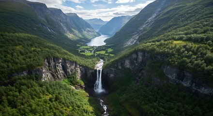 Majestic Waterfall Cascading Through Lush Green Valley Landscape.