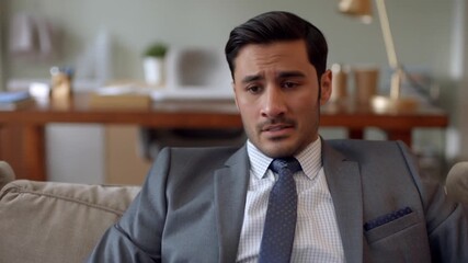 A man in a suit displays an expression of worry. The lighting and setting evoke a sense of contemplation Stock Video