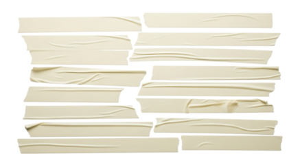 Arrangement of torn beige masking tape strips on a black background
