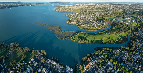 Aerial view of Westmere, Auckland, New Zealand, showing the city skyline, residential areas, and...