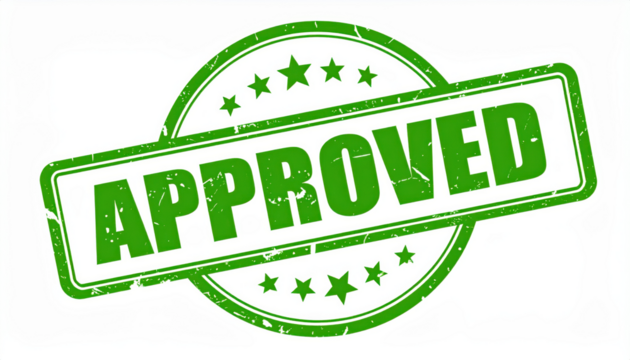 Approved Stamp: A detailed view of a green rubber stamp with APPROVED boldly printed, embodying endorsement and authorization.