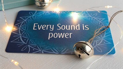 Silver Bells with Holographic Blue Card Displaying Inspiring Text