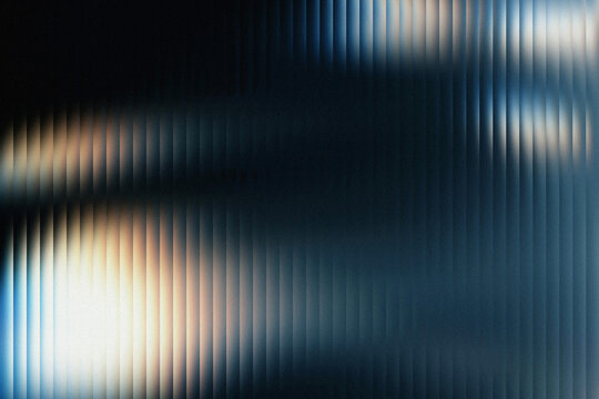 Abstract background with vertical lines and blurred light creating a textured appearance in blue tone