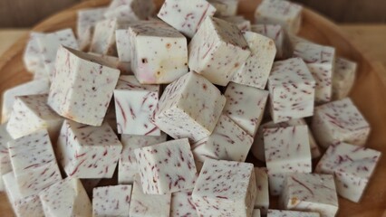 Fresh taro cube dice on plate.