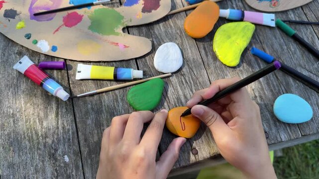 Focused Little Children Painting Stone with Bright Acrylic Colors During Creative Art Activity at Home DIY Craft Project for Kids, Childhood Learning and Fun Indoor Hobby Concept
