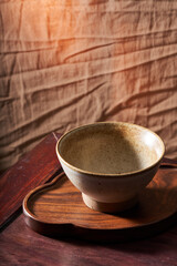 An empty rice bowl tableware with a retro wooden background