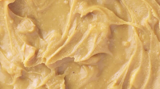 Closeup view of tasty peanut butter. Macro shot
