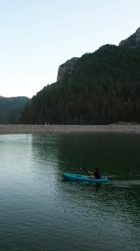Man Kayaking in Scenic Mountain lake at Tibble Fork Reservoir in American Fork Canyon, UT, Aerial