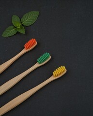Embrace sustainable oral care with natural bamboo toothbrushes and fresh mint leaves, promoting eco-friendly hygiene for a healthier planet and brighter smile