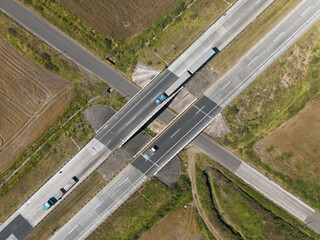 Aerial Drone View of Modern Urban Highway Intersection with Cars and Bridges © Victor