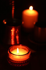 Beautiful burning candles on black background