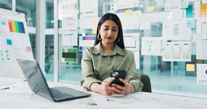 Business woman, web designer or phone with laptop for planning, strategy or UX in office. Female person, developer or computer on mobile smartphone for app design, UI or testing software in workplace - Powered by Adobe