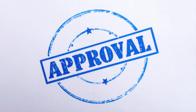Official Approval Seal: A crisp, blue approval stamp boldly proclaims APPROVED within a circular border, communicating a message of confirmation and authority.