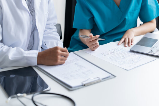 Doctor and Medical Team Discussing Patient Care