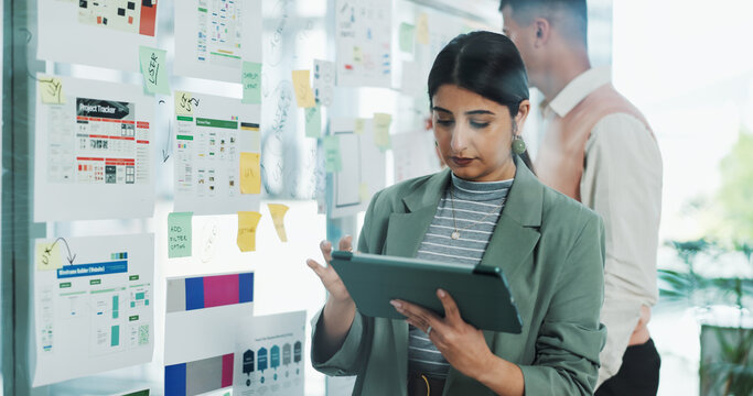 Glass wall, tablet and business woman in office for mobile app software, website and ui design. Digital agency, tech and person with paperwork, ideas and layout for research, planning and project