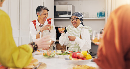 Cooking, kitchen and mature women with wine for bonding, conversation and culinary lesson. Happy, social reunion and senior friends with alcohol, toast and food for learning recipes together in home