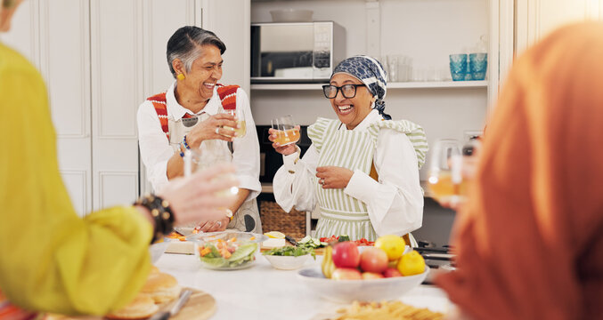 Cooking, kitchen and mature women with wine for bonding, conversation and culinary lesson. Happy, social reunion and senior friends with alcohol, toast and food for learning recipes together in home - Powered by Adobe