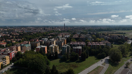 Fototapeta premium Panoramic Drone Aerial View of Cremona Cityscape Lombardy Italy Capturing Diverse Architecture and Green Spaces Under a Partly Cloudy Sky