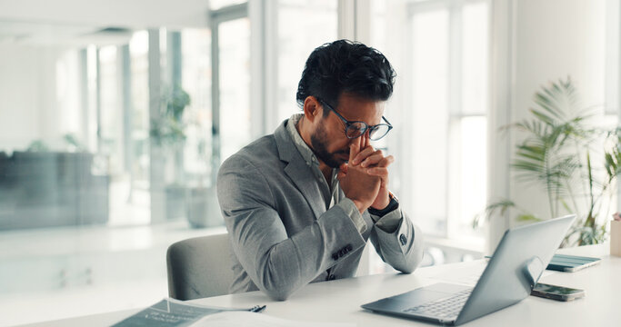 Frustrated, businessman or headache with stress, laptop or eye strain for deadline in office. Tired man, employee or analyst with migraine on computer for mistake, pressure or overworked in workplace