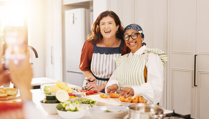 Happy women, picture and kitchen with vegetables for meal prep, memory or friends cooking in home. Female people, group or smile with photography, ingredients or recipe for food, gathering or capture
