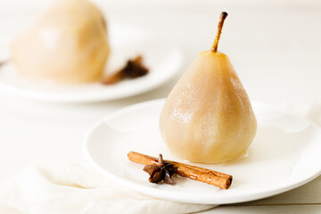 Poached pears with spices in syrup.