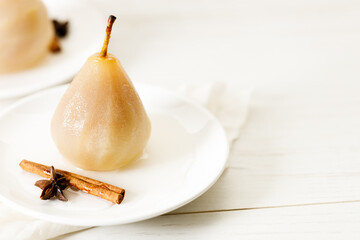 Poached pears with spices in syrup.