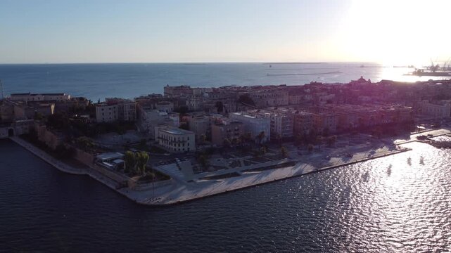 Aerial View Of Taranto - Historic Coastal City In Apulia, Italy On Sunny Afternoon. pullback panning shot
