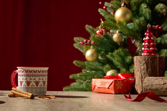 Stacked from 7 images. Method=B (R=9,S=4)Christmas wooden table with red gifts, pine branches, and candle beside green tree, red curtain background, soft holiday light. - Powered by Adobe