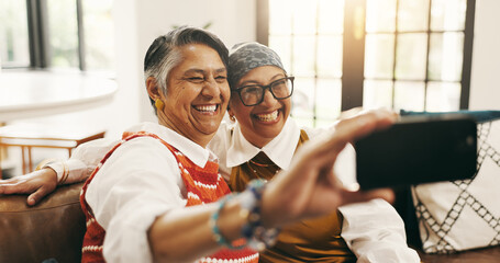 Selfie, happy and senior women on sofa for memory together on weekend with bonding in home. Smile,...
